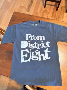 Custom "From District Eight" t-shirt printed in light ink on a faded navy tee