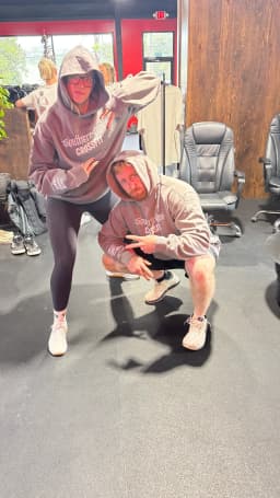 Custom Southern Pines CrossFit hoodies worn by two gym members