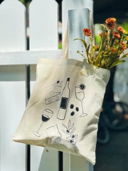 Custom screen printed wine and cheese tote bag in black ink on natural canvas