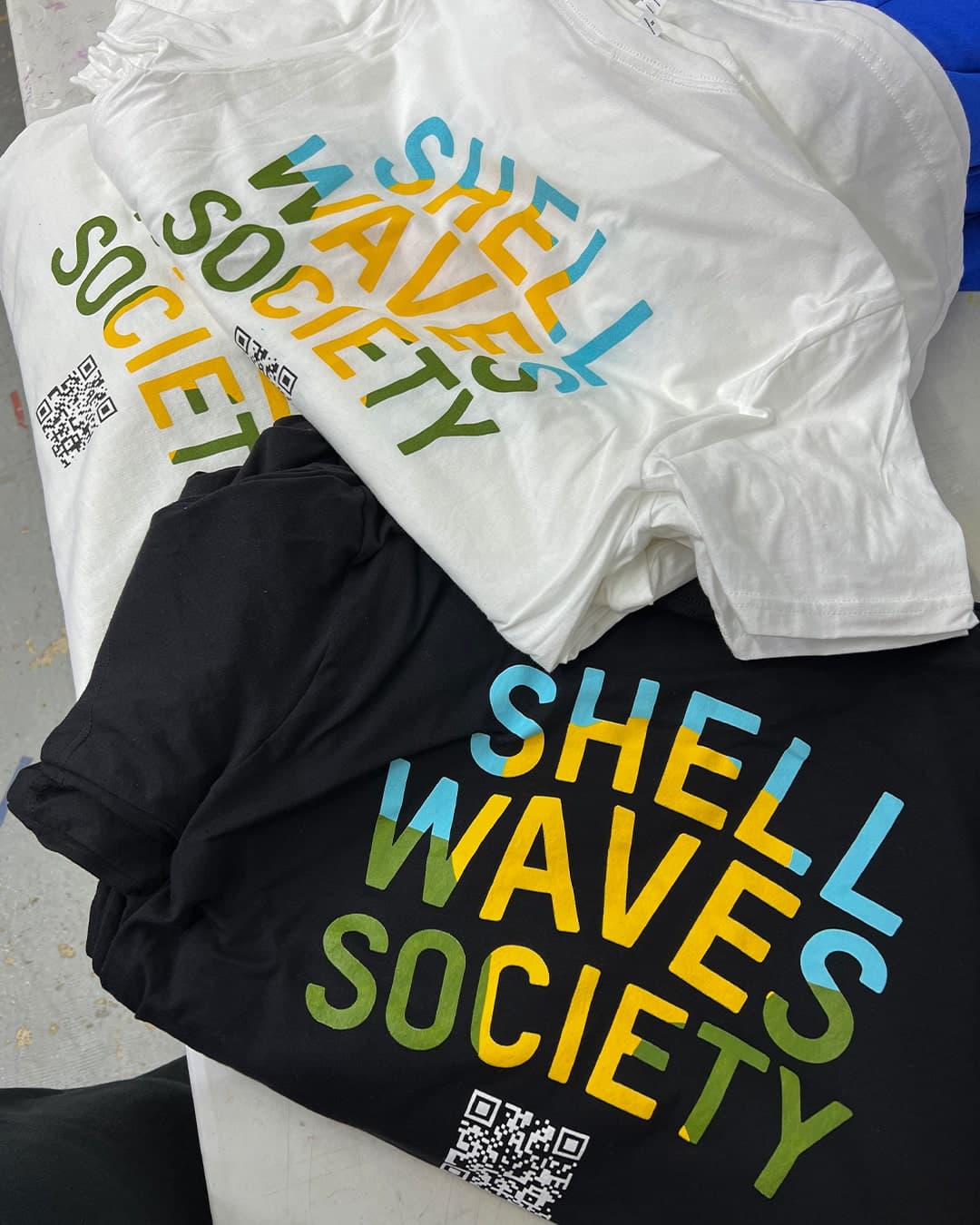 Bulk custom screen printed shirts — completed order by Tee Vision Printing