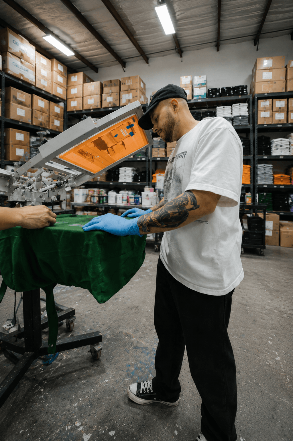 Tee Vision screen printing New York — pulling a print at our NYC shop