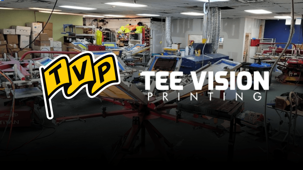 A screen printing shop filled with equipment, illustrating the production process behind creating custom apparel and deciding which fit style is best for your merch.