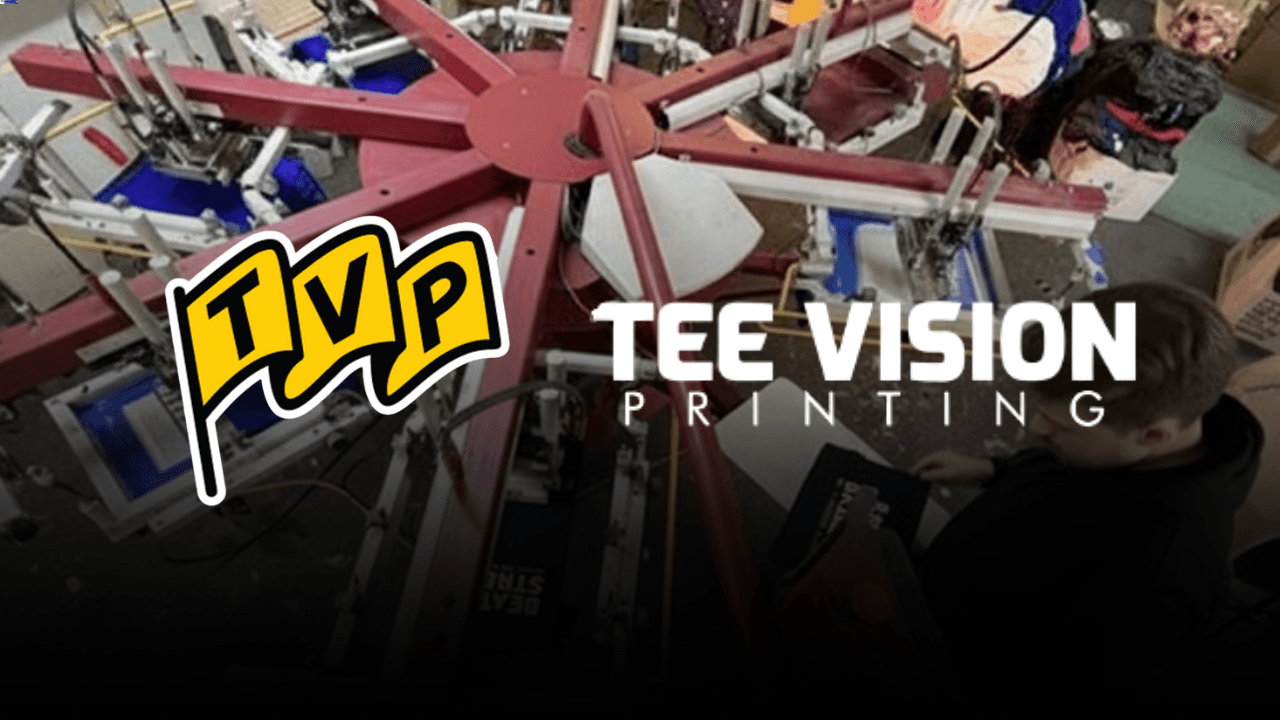 Multi-arm screen printing press used for cotton blends and fleece garments, demonstrating screen printing on fleece and DTG on cotton in your seasonal fabric guide for fall apparel fabrics.