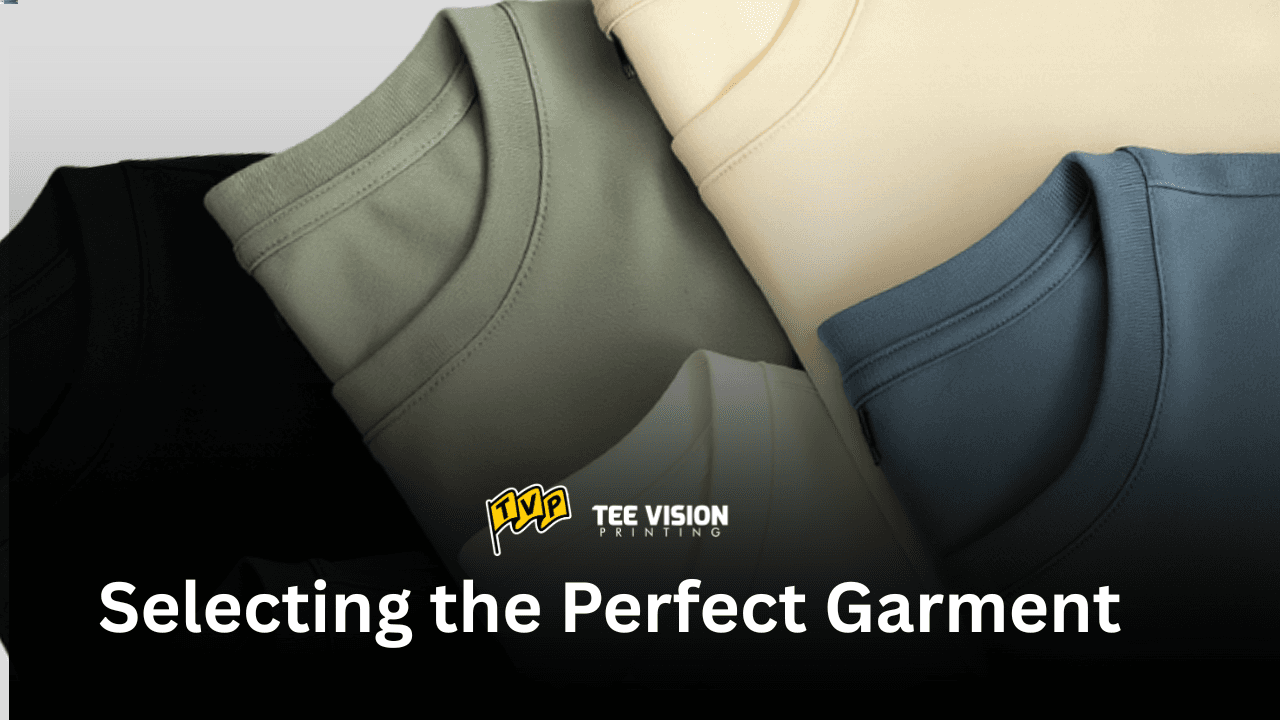 Five folded t-shirts in various colors displayed under the Tee Vision Printing logo, highlighting the importance of garment choice in DTG printing—perfect for readers exploring what is DTG printing and how fabric type affects print quality.