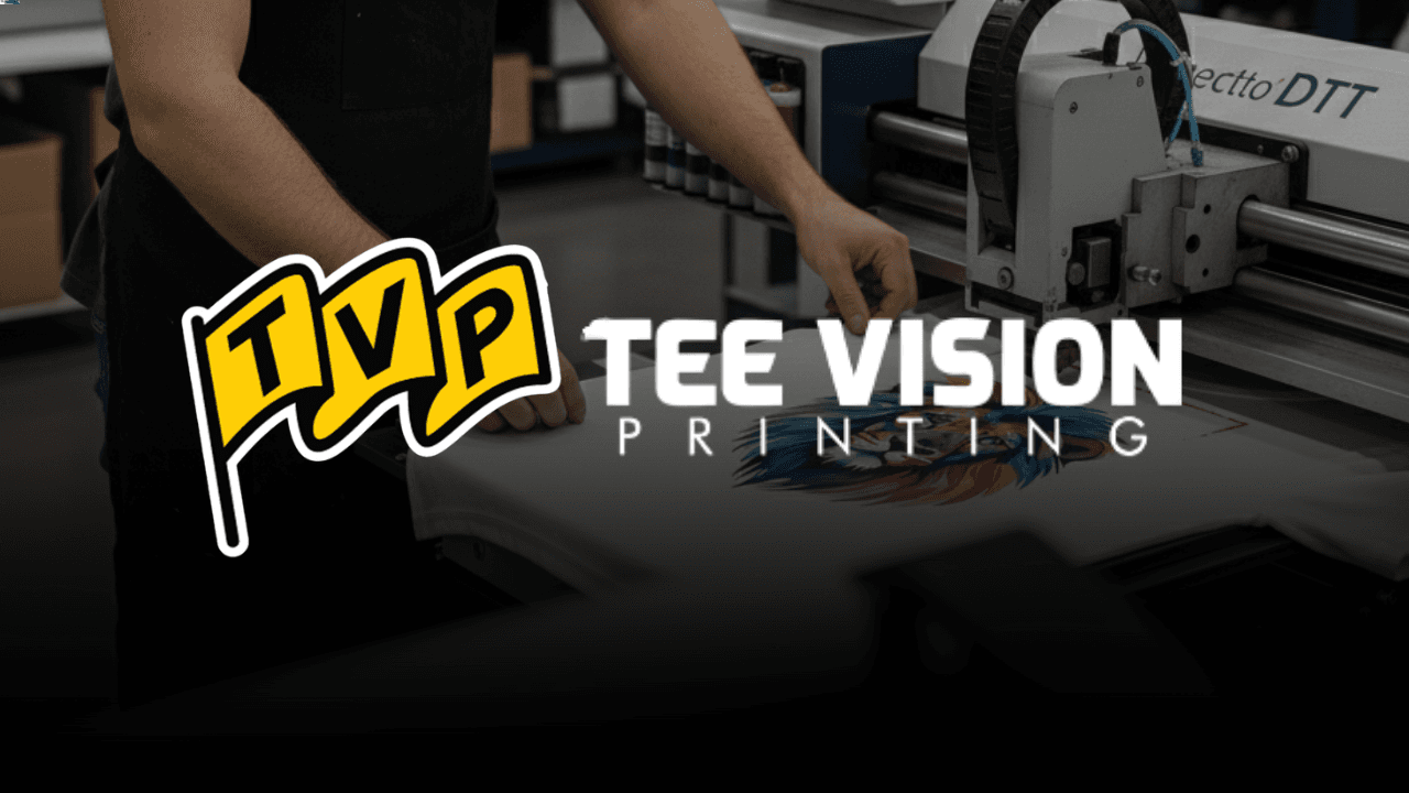 A technician operates a Spectro DTT direct-to-garment printer, applying a vibrant design onto a white t-shirt—an ideal visual for understanding what is DTG printing and how it delivers high-resolution artwork directly onto fabric.