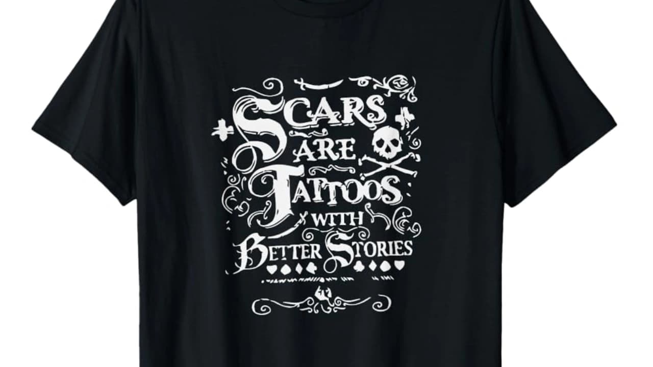 Black t-shirt with "CARS ARE TATTOOS WITH BETTER STORIES" graphic, an example of a unique t-shirt design.