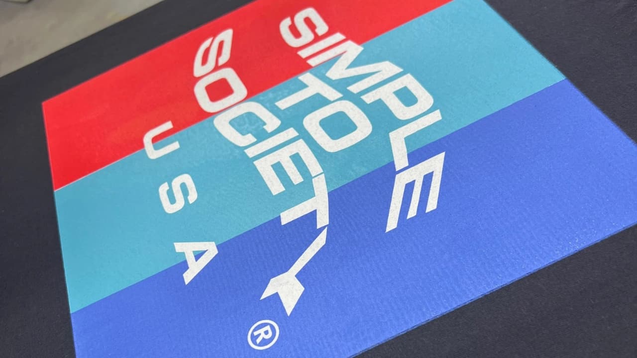 A close-up of our custom t-shirt silk screen printing, showing sharp lines and vibrant colors on graphic design apparel.