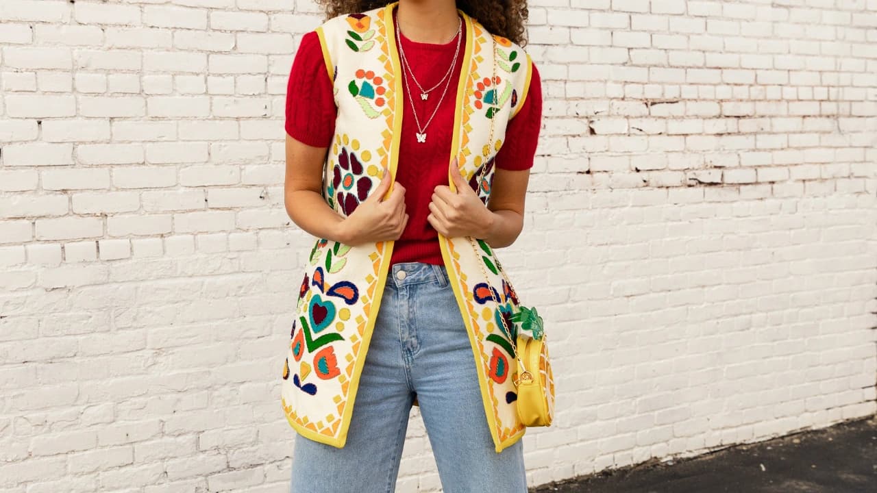 Our apparel design services can create unique graphic design apparel, like this stunning long vest with custom embroidery.