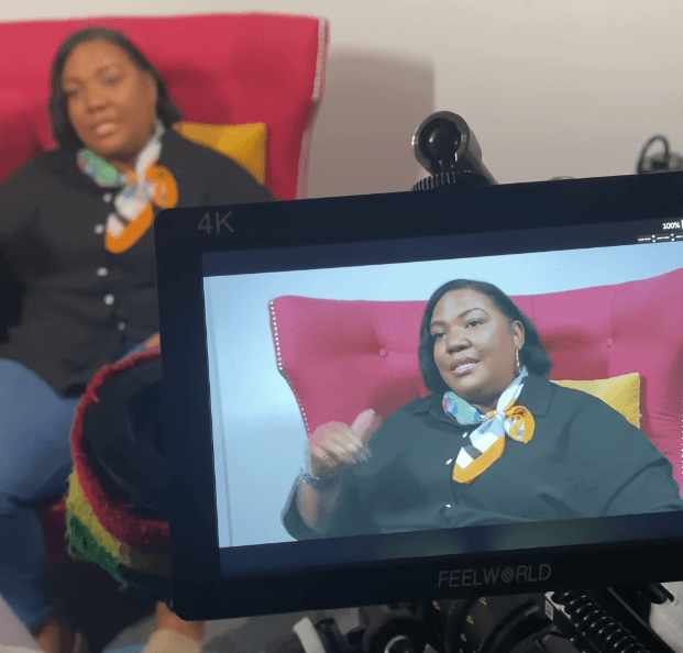 Dr. Sarita Lyons speaking during a recorded session, highlighting the ministry movement supported by her custom Christian church apparel line.