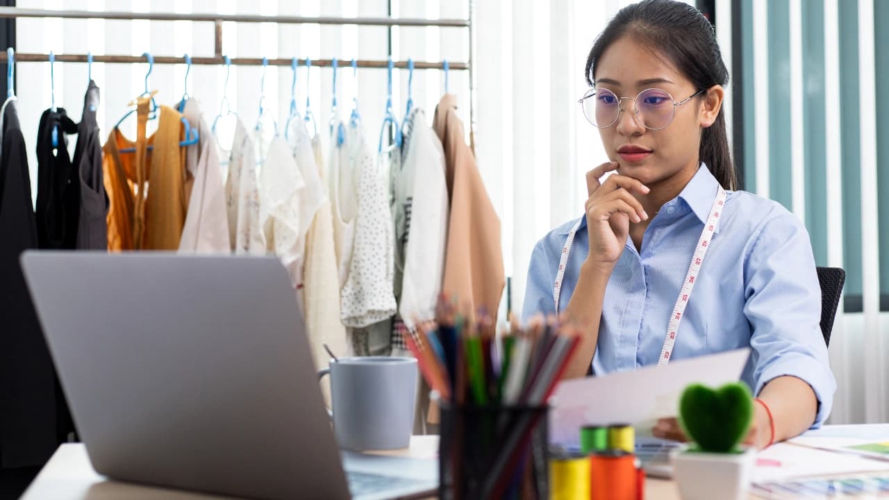 Our lead designer reviewing new custom t-shirt design ideas. This is where our expert apparel design services begin.