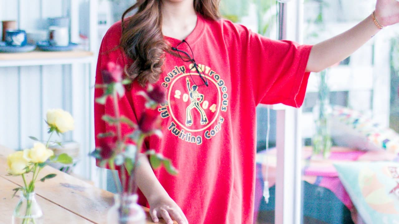 Our apparel design services create memorable graphic design apparel, like this custom retro-style twirling corps shirt.