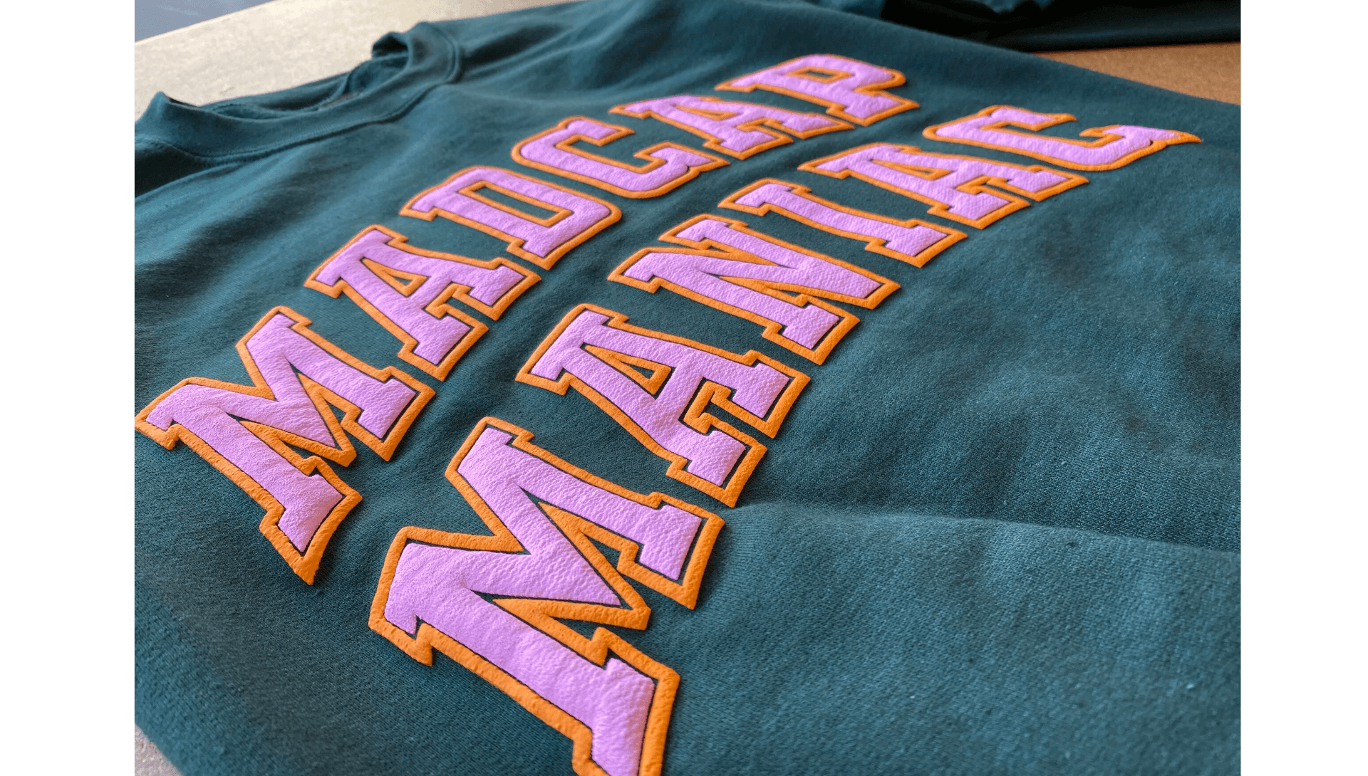 Close-up of puff print texture showing 3D raised design effect